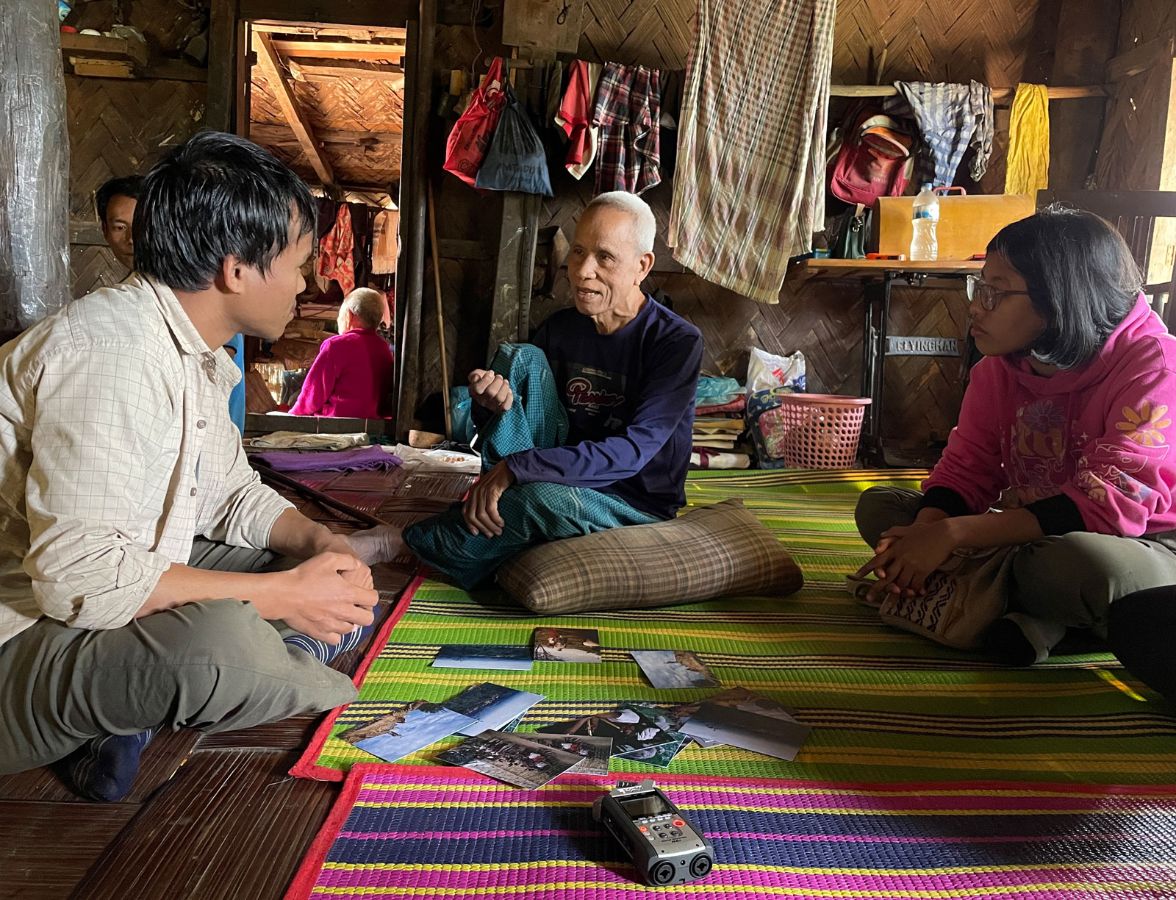 Students interviewing Menpong Mro, head of Empu Para village, where Lorenz Löffler did field research in 1956